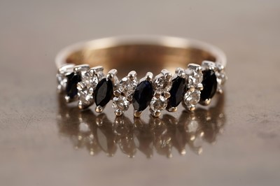 Lot 21 - A modern sapphire and diamond half hoop eternity ring