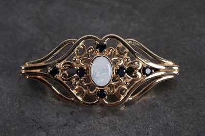 Lot 30 - An Edwardian Revival opal and sapphire brooch