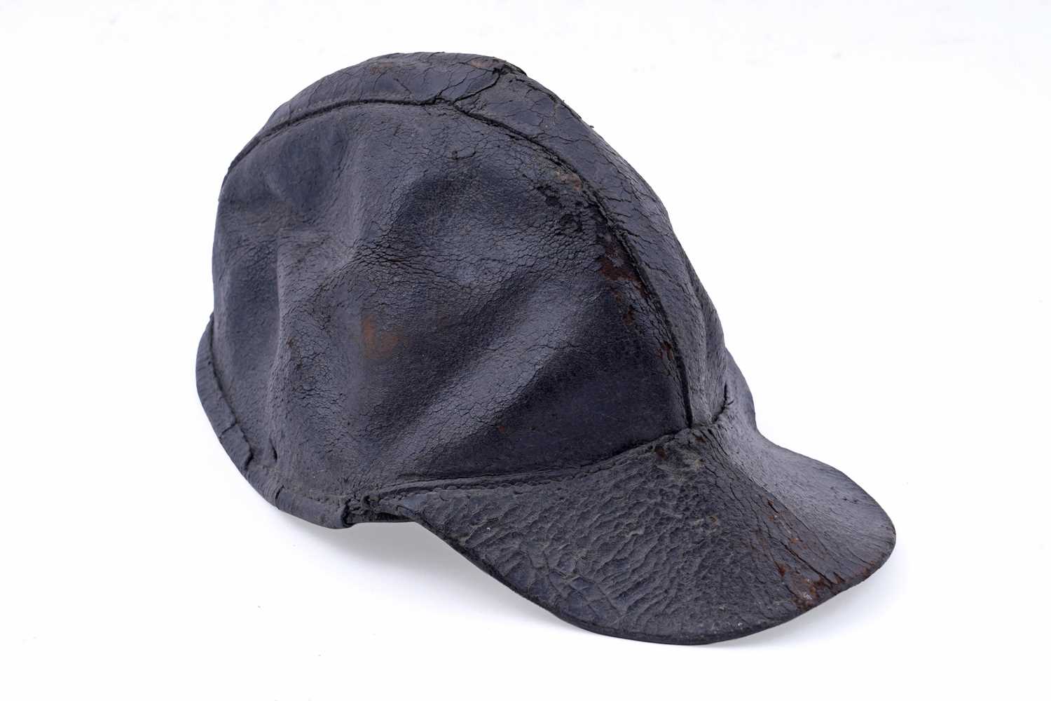 Lot 160 - A 19th Century stitched leather miner's peaked cap
