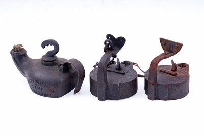 Lot 201 - Two 19th Century Continental ‘Frog’ type miners’ lamps; and a cast iron