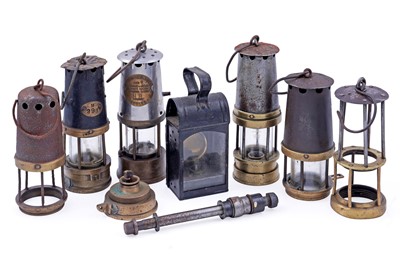 Lot 248 - A collection of miners lamps and lamp parts