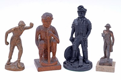 Lot 245 - Four figural studies of miners; and a selection of miniature or presentation miner’s lamps