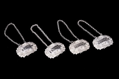 Lot 185 - A set of four George IV silver bottle labels