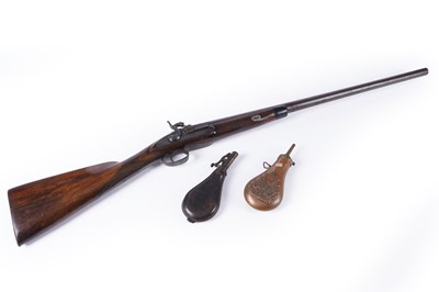 Lot 263 - A 19th Century percussion cap shotgun; and two powder flasks
