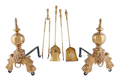 Lot 201 - A pair of 19th Century brass fire dogs; and a set of irons