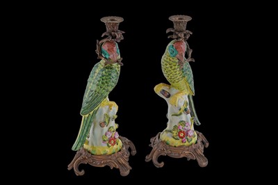 Lot 184 - A pair of 20th Century porcelain and gilt metal mounted candlesticks