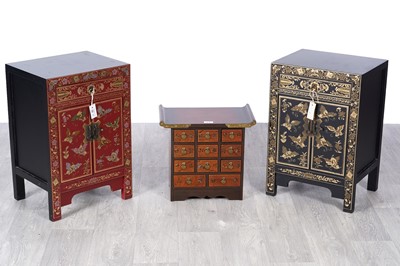 Lot 47 - An opposed pair of 20th-century red lacquered parcel-gilt bedside cabinets