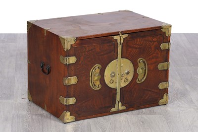 Lot 37 - A 20th Century Korean brass-mounted elm cupboard