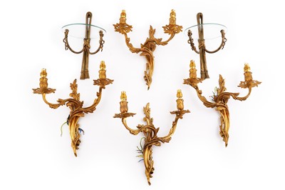 Lot 172 - Two pairs of gilt metal wall sconces; and a similar pair of wall mounted shelves