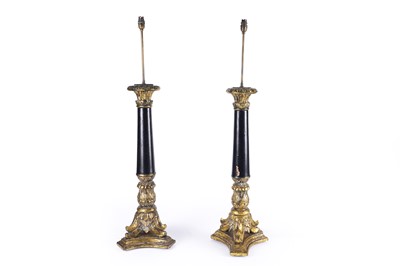 Lot 179 - An impressive pair of gesso and ebonised carved table lamps