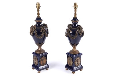 Lot 180 - A pair of cobalt blue urn-shaped porcelain table lamps