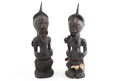 Lot 219 - Two Congolese Songye Nkishi style carved hardwood figures