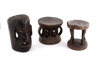 Lot 218 - Two African Tonga style carved hardwood stools and a mask