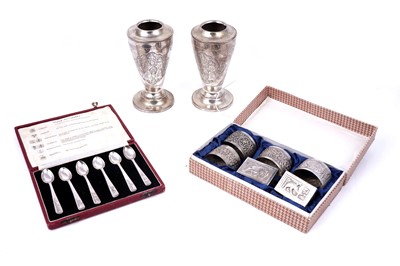 Lot 169 - A cased group of six Eastern white metal napkin rings; and other items