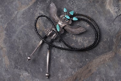 Lot 77 - A Native American Navajo silver and turquoise set bolo tie