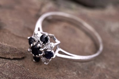 Lot 58 - A sapphire and diamond ring