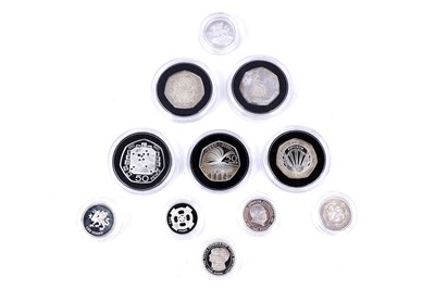 Lot 80 - A selection of silver proof £1 coins; and 50p proof coins