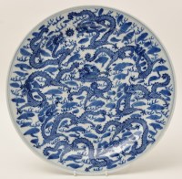Lot 147 - Chinese blue and white dragon dish, with...