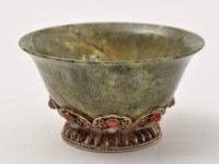 Lot 169 - Small Sino-Tibetan white meal mounted green...