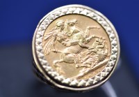 Lot 584 - An Edward VII gold sovereign, 1910, in 9ct....