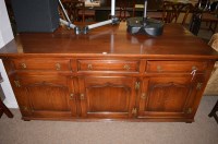 Lot 645 - A 20th Century oak sideboard, fitted three...