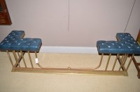 Lot 745 - A brass club fender, with blue buttoned...