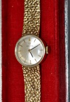 Lot 683 - A 9ct. gold lady's Omega cocktail watch, the...