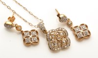 Lot 828 - A diamond set pendant of quatrefoil form with...