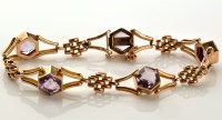 Lot 846 - An amethyst and 9ct. gold bracelet, with five...