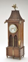Lot 891 - A Black Forest carved walnut and brass mantel...